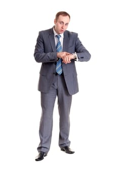 businessman looking with amazement at his watch in his hand