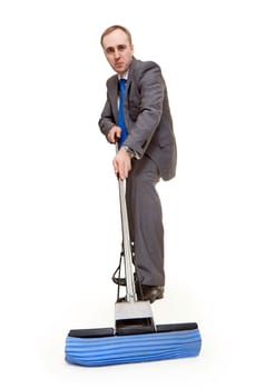 businessman with a mop washes the floor on a white background
