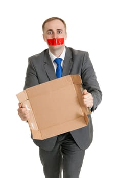 Businessman with his mouth sealed with red tape and cardboard in their hands