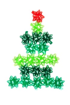 Spruce from green gift ribbon on a white background