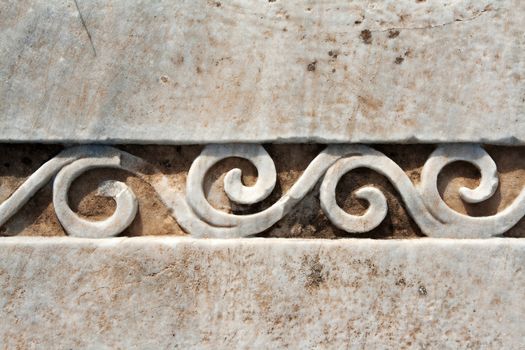 Carved patterns in the old white marble
