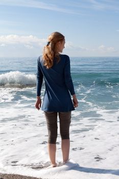 The girl on the beach in a dress