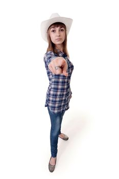 girl in a hat shows his finger on a white background