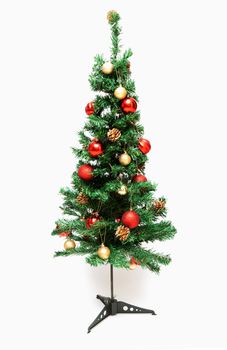 Cristmas spruce decorated toy, ball and big shot on white background