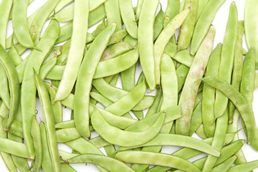 Green beans in the form of a white background