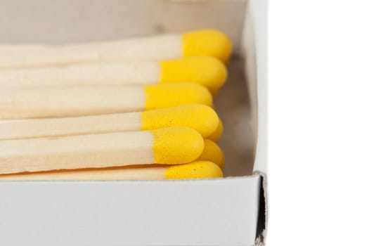 open boxes of wooden matches and yellow-head