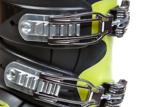 Clasps ski shoe on black and green plastic