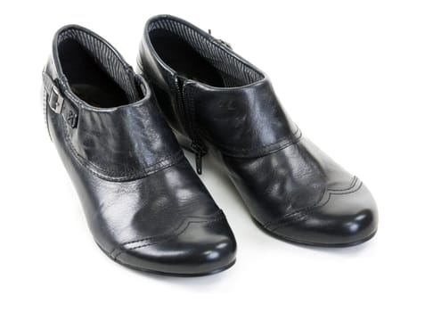 pair of black leather women's shoes on a white background