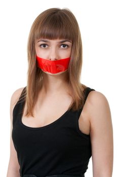 beautiful girl with her mouth sealed with red tape