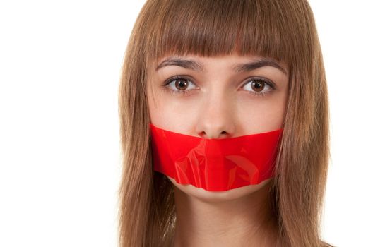 beautiful girl with her mouth sealed with red tape