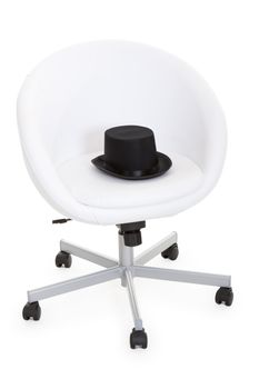 black slouch hat is a white leather armchairs