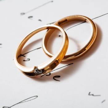 Stock photo: an image of two rings on a letter