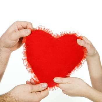 Stock photo: an image of a big red heart in the hands of a woman and a man