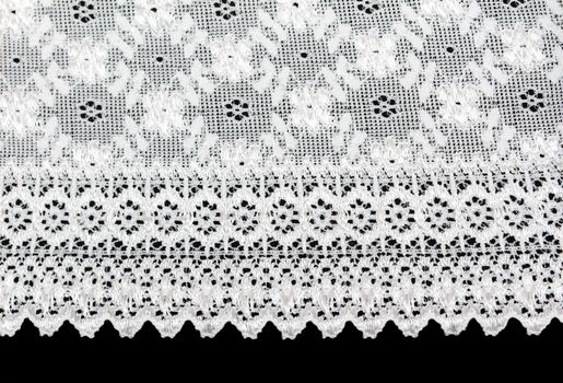 White lace with a floral pattern on a black background