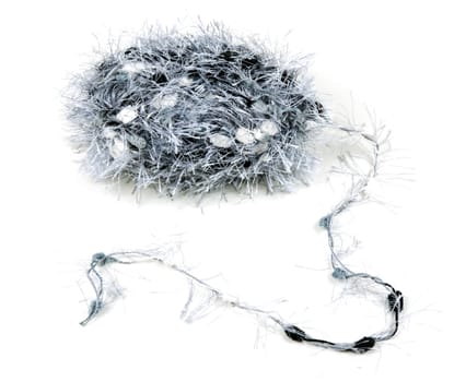 ball of fluffy gray thread on a white background