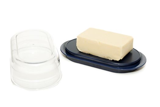 Piece of butter on the Oiler blue with a transparent lid