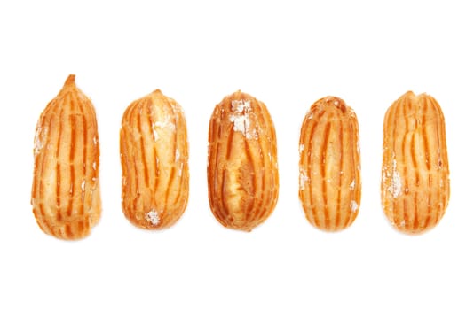 Delicious eclairs arranged unlikely on a white background