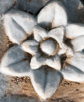Carved patterns in the old white marble