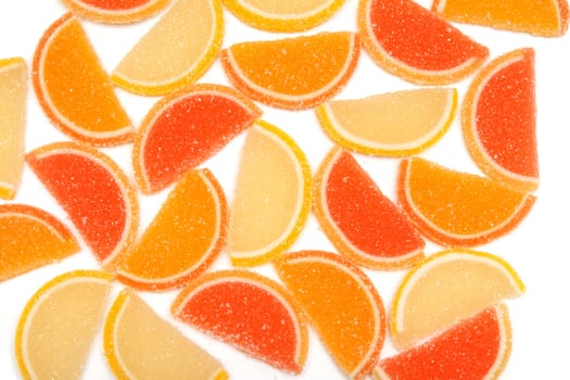 colored jelly sweets laid on a white background