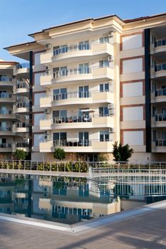 beautiful house with balconies and a pool