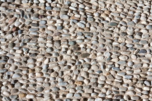 pavement of small stones and a large white crystal