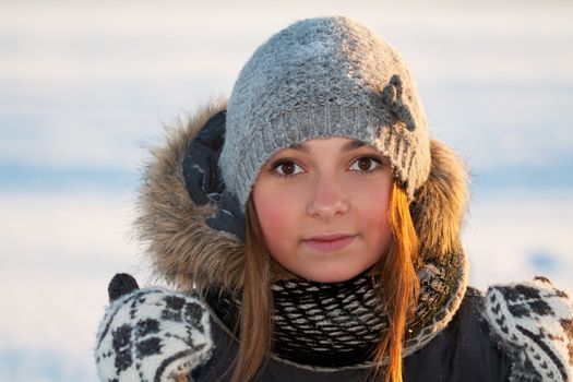 portrait of a young beautiful girl in the cold