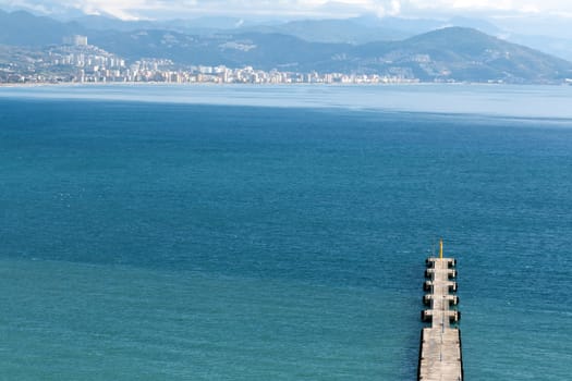 Pier into the sea and mountain views and Alanya