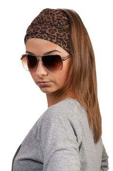 portrait of a girl with glasses in a leopard scarf on a white background