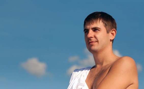 Portrait of a man against the sky looking into the distance