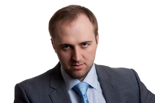 portrait of an unshaven businessman in a gray suit with a white background