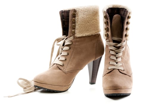 pair of beige women's shoes with fur on the heel