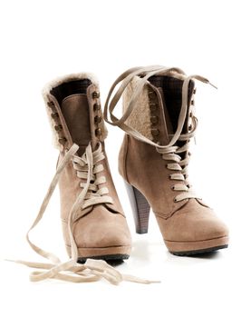 pair of beige women's shoes with fur on the heel