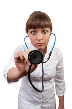 beautiful young woman doctor with a stethoscope sings on a white background