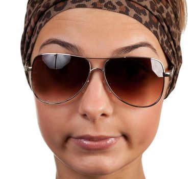 portrait of a girl with glasses in a leopard scarf on a white background