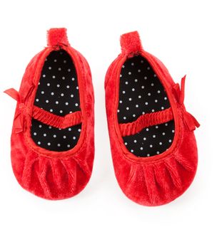 red baby booties isolated on white background