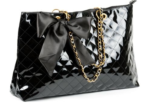 black glossy women's handbag isolated on a white background