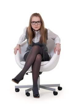 strong girl sitting in an armchair on a white background