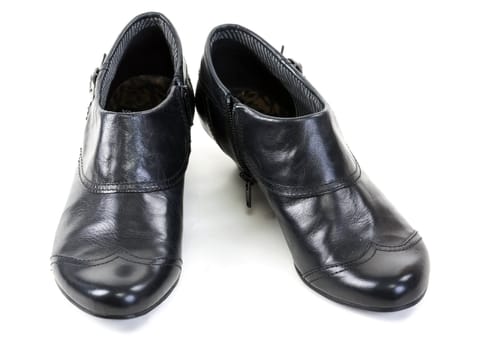 pair of black leather women's shoes on a white background