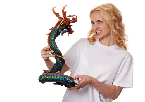 beautiful girl with a wooden dragon isolated on a white background