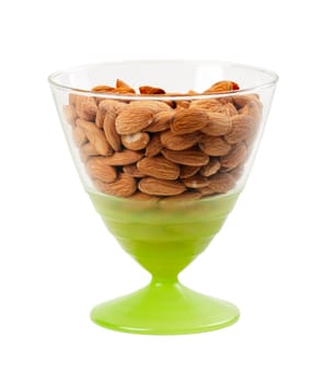 nuts, almonds in clear glass vase isolated on white background