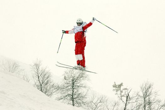 skier in red trousers, flip in the air
