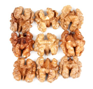 nine walnut halves isolated on white background