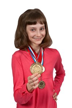Girl shows gold medal winner isolated on a white background