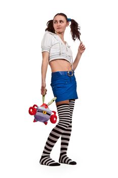 girl in striped socks, mini skirt with a toy and Pigtails