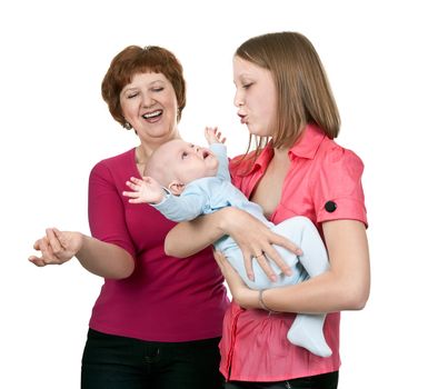 grandmother and mother soothe crying baby on a white background