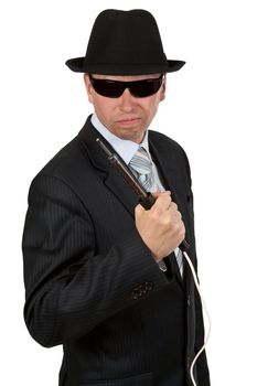 businessman wearing sunglasses and a felt hat with a soldering iron in his hand
