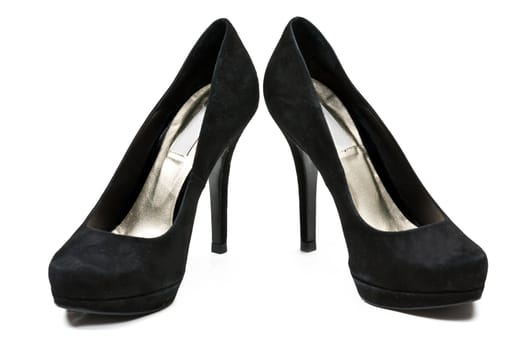 pair of black suede women's high heel shoes isolated on white background