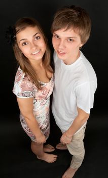 boy and girl isolated on black background