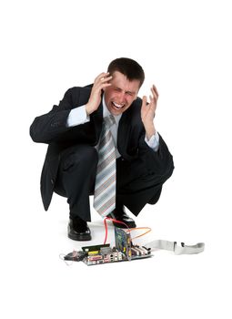 businessman is crying over the broken computer on a white background