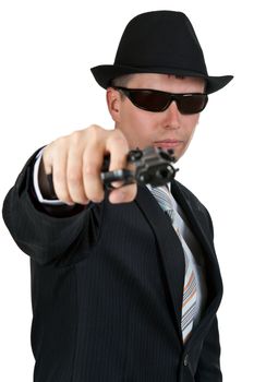 businessman in a hat and sunglasses with a gun on a white background